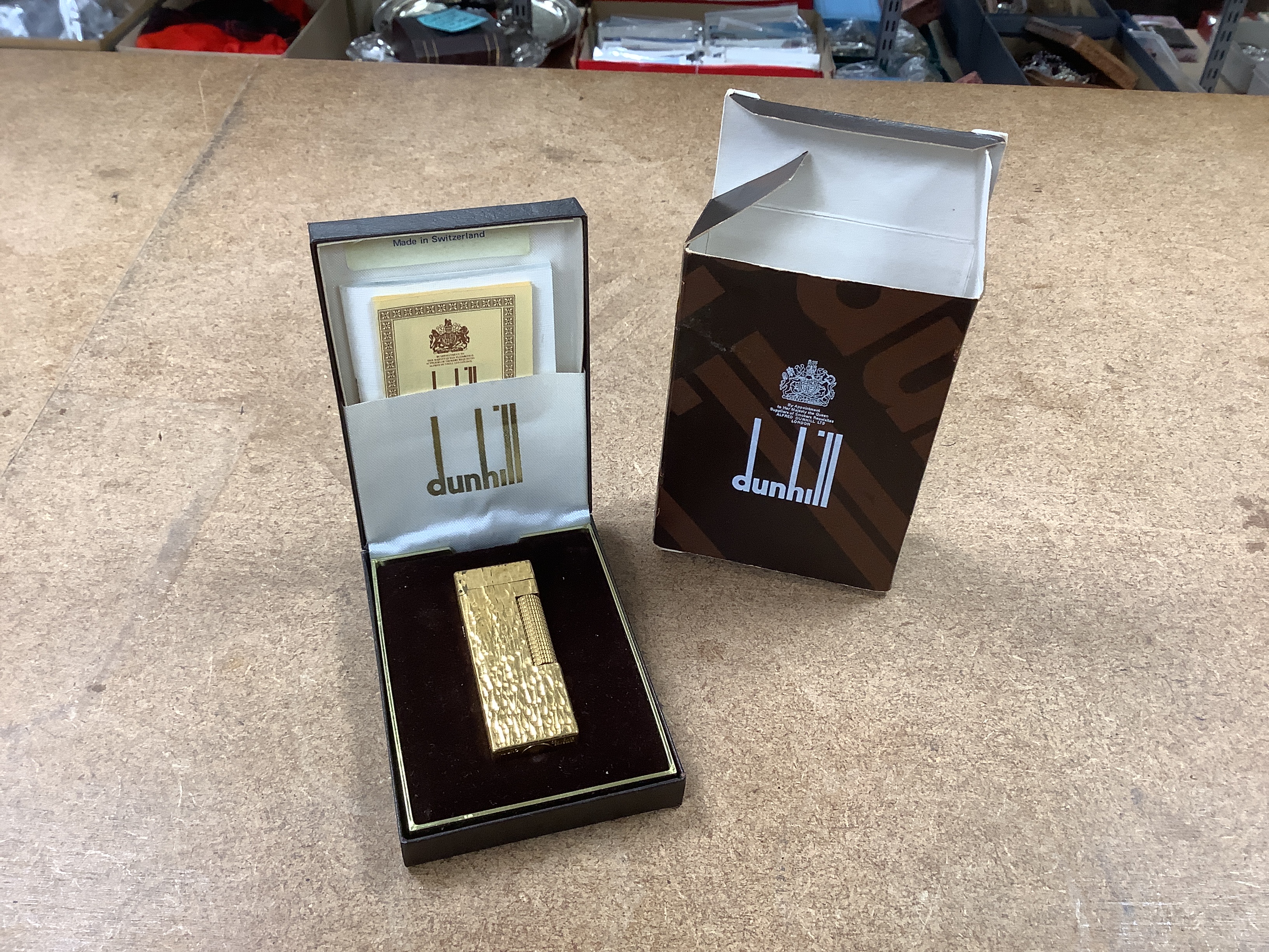 A large collection of various lighters, including a boxed Dunhill gold plated Rollagas